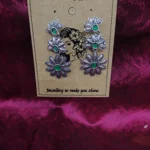 Petals blossom earrings feature textured Silver